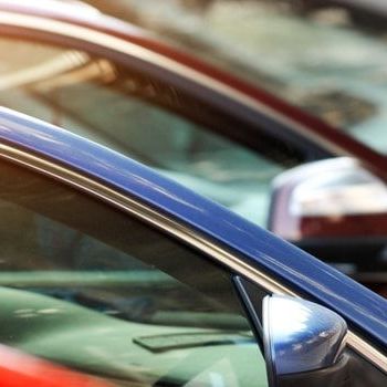 Cars parked neatly in a parking lot.