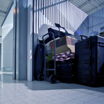 Various personal items stacked inside of a storage unit.