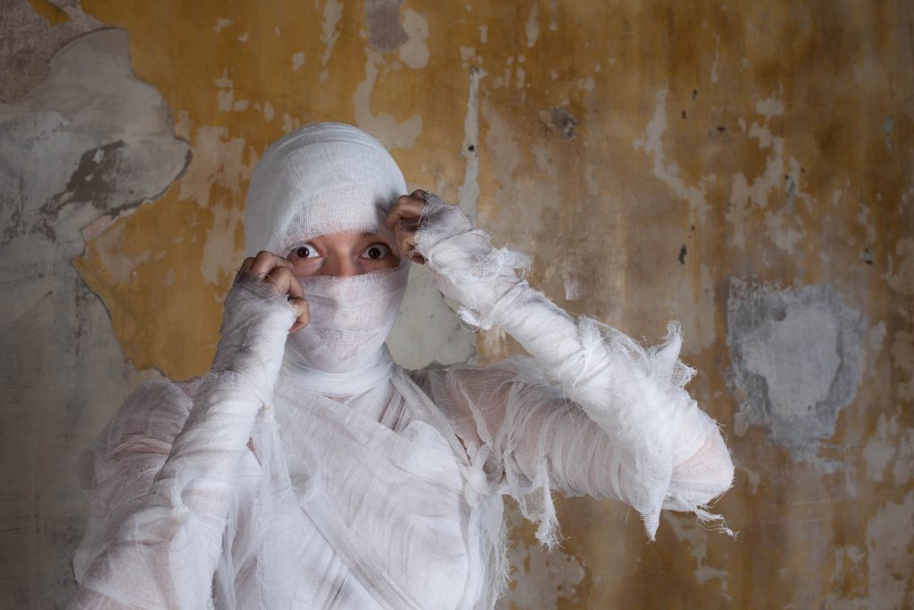 A man in a DIY mummy costume.