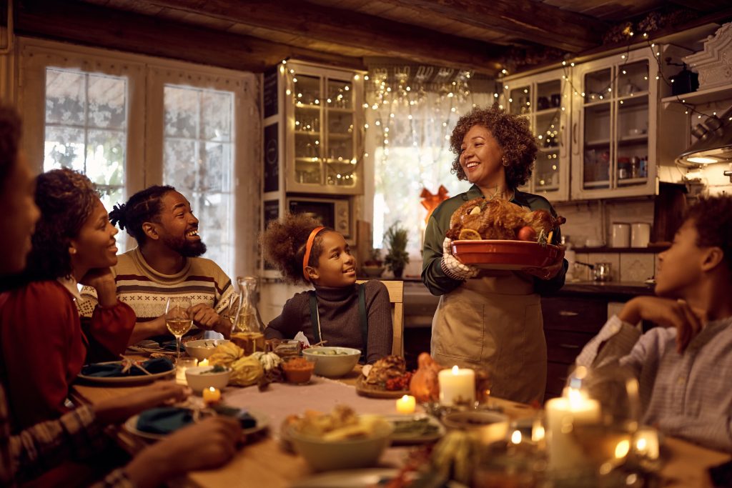 A family gathered at the table for Thanksgiving dinner.