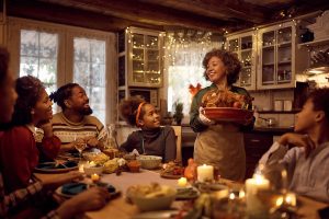 A family gathered at the table for Thanksgiving dinner.