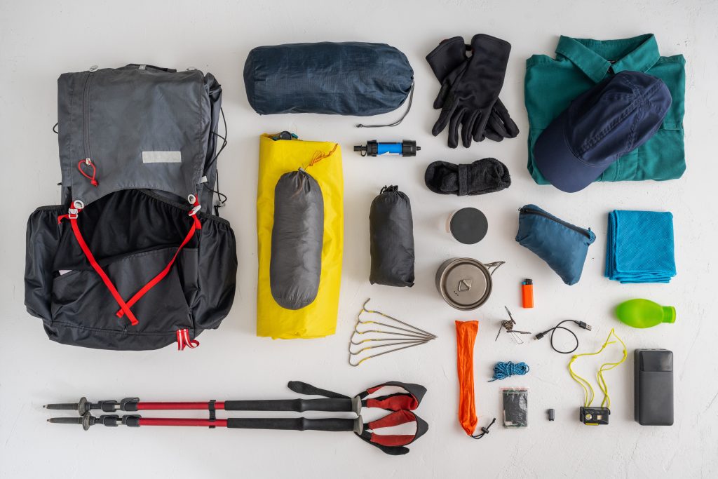 Assorted camping gear on a table.