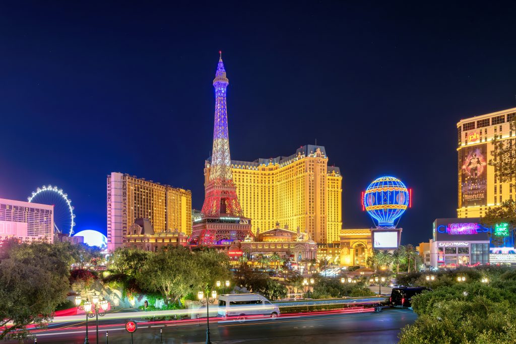 The Eiffel Tower restaurant and other brightly lit buildings in Las Vegas.